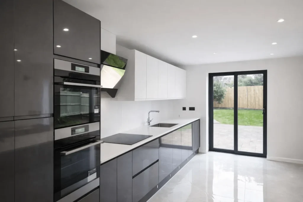 Modern kitchen renovation with gloss units and integrated appliances in Ilford, IG1