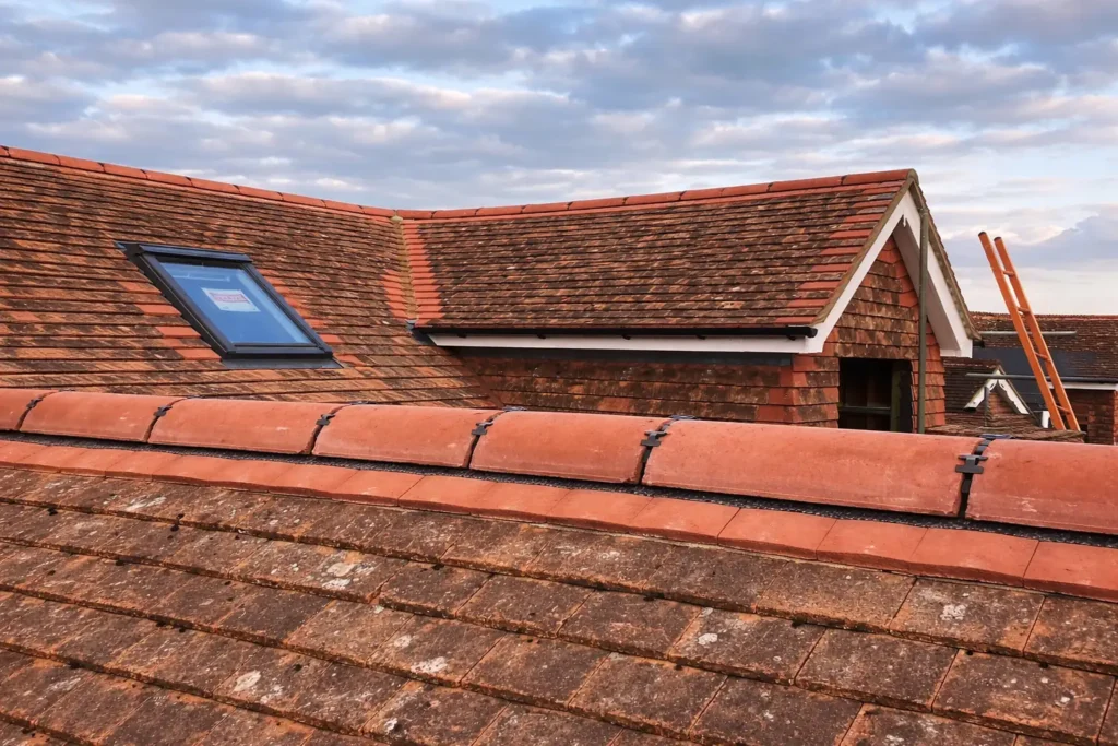 traditional clay tile roof repair with roof window london | AJ Contractors Builder | Home Extensions & Renovation in East London