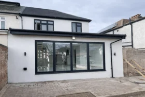 Loft conversion in Ilford East London with rendered rear extension and contemporary glazing