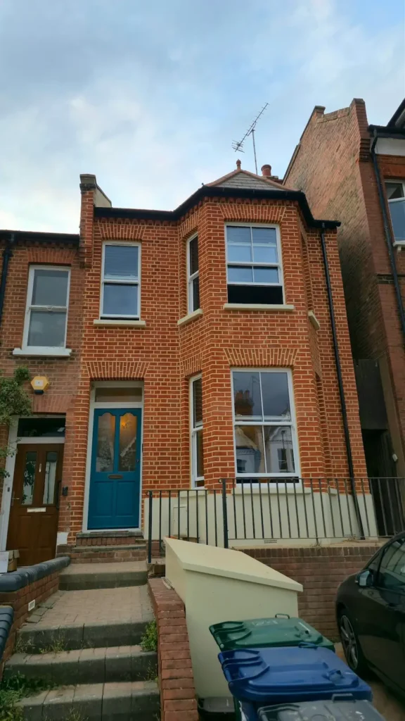 Victorian terraced house after brickwork restoration in London